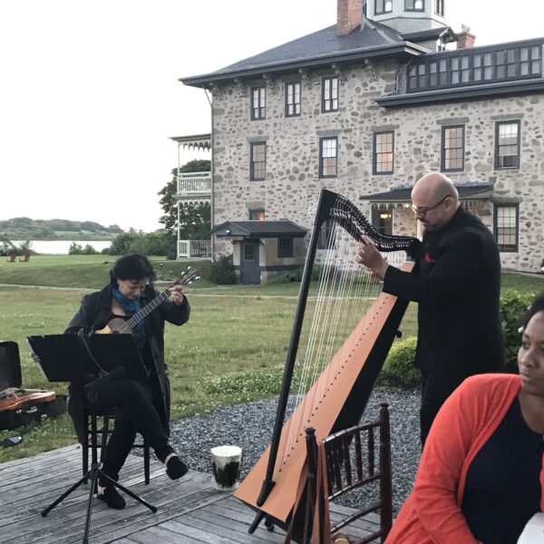 People performing music outside Institute