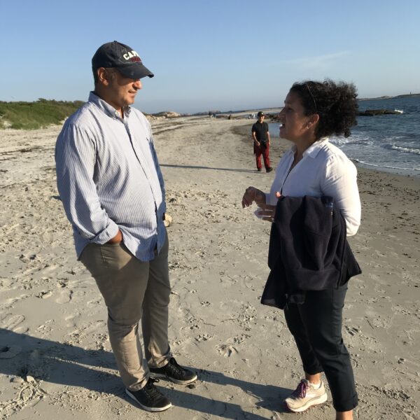 Two Institute Participants have a conversation on beach